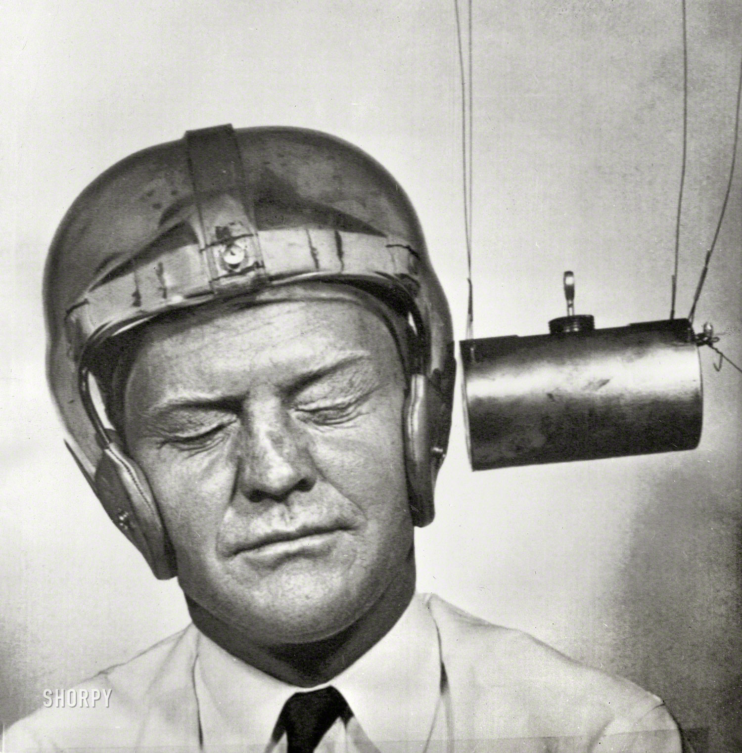 September 13, 1950. "Pendulum pounding into a plastic helmet worn for testing by Dr. Charles F. Lombard, director of the University of Southern California Department of Aviation Physiology. Testing is part of a program being worked out to improve equipment, especially headgear for football players, to cut down fatalities and injuries among gridders." Acme Newsphoto. View full size.