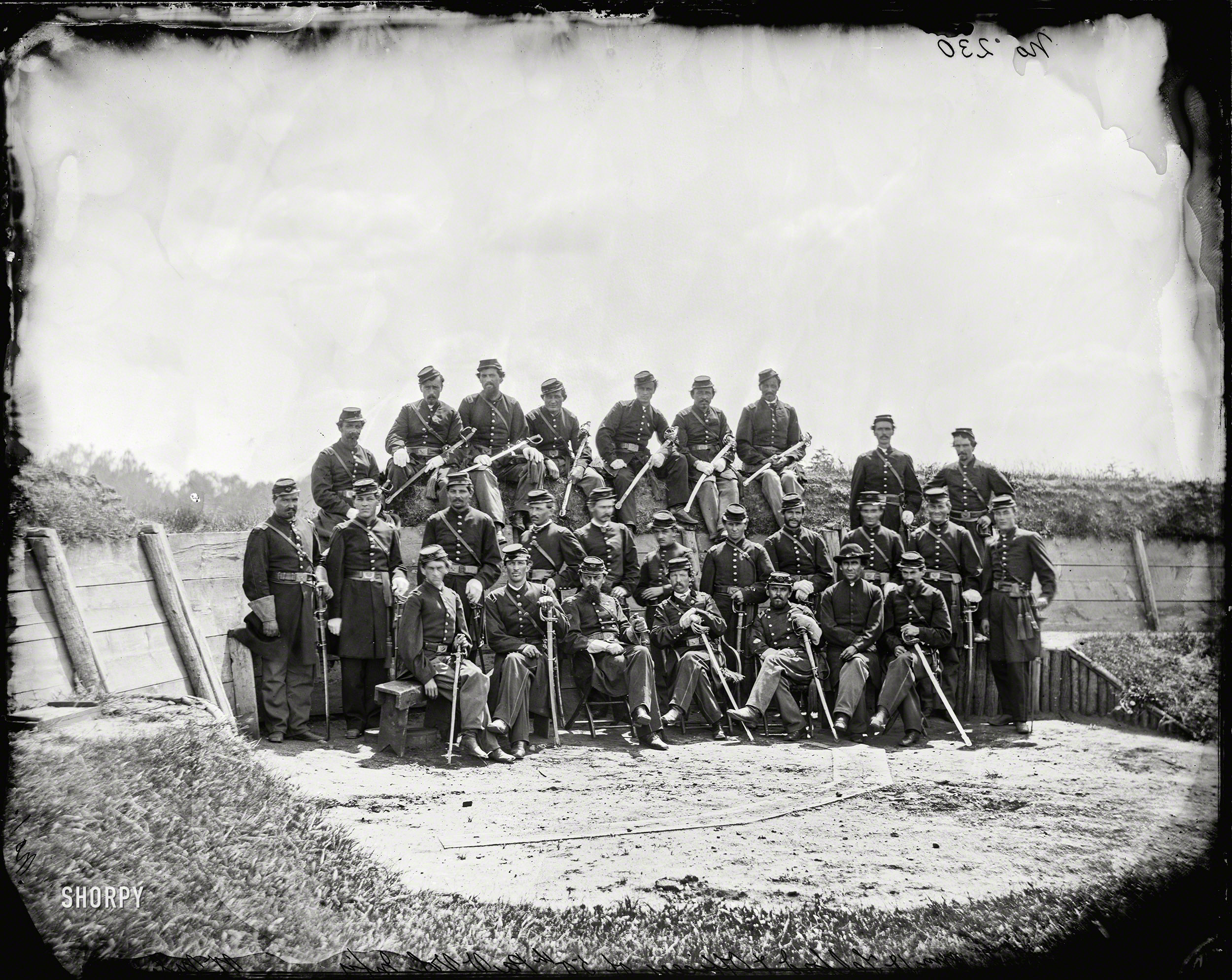 July 1865. "Col. William Telford and officers of the 50th Pennsylvania Infantry at Gettysburg." Wet plate negative by William Morris Smith. View full size.