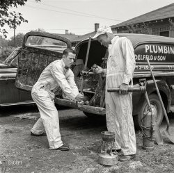 May 1954. "High school football player Paul Delfeld, 17, of North Dallas, Texas, helping father at plumbing business. Other photos show Delfeld attending high school classes; practicing football with teammates; playing in game; working at ice cream parlor; attending various social functions with girlfriend Janelle Gibson and other teenagers." Medium format negative from photos taken for the Look magazine assignment "High School Hero." View full size.