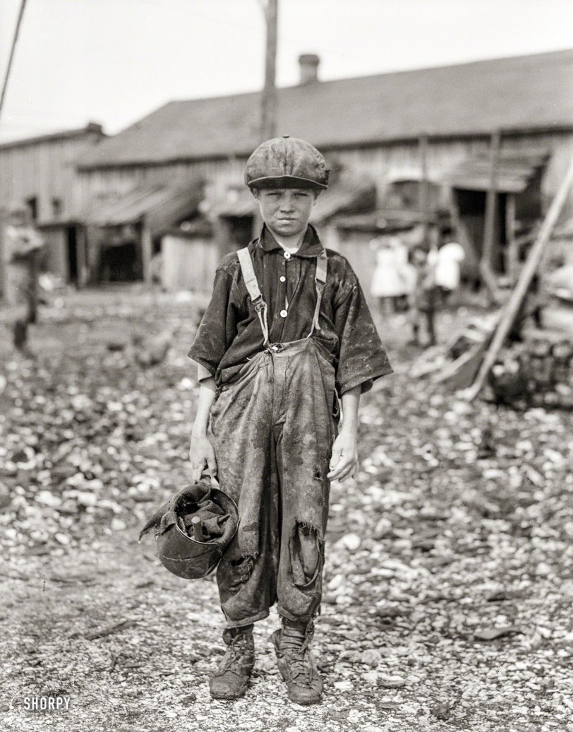 February 1912. "Henry, 10-year-old oyster shucker who does five pots of oysters a day. Works before school, after school, and Saturdays. Been working three years. Maggioni Canning Co., Port Royal, South Carolina." Glass negative by Lewis Wickes Hine for the National Child Labor Committee. View full size.
