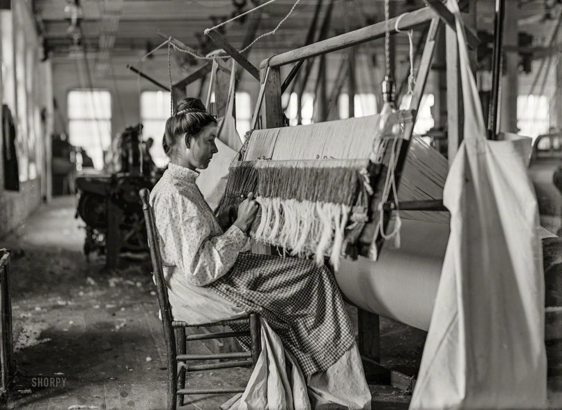 November 1908. "Woman at beam warper. Melville Mfg. Company, Cherryville, North Carolina." 5x7 glass negative by Lewis Wickes Hine. View full size.
