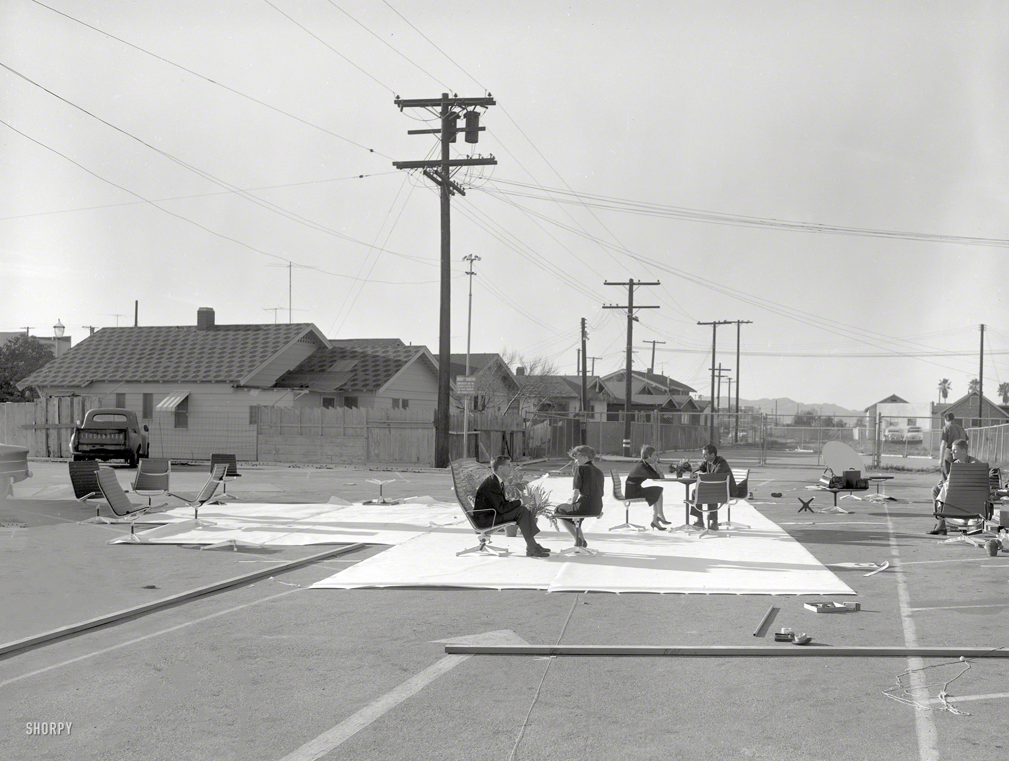 Somewhere around Los Angeles circa 1958. "Aluminum Group furniture (chairs, ottomans, tables) designed by Charles Eames for Herman Miller Inc." Our third behind-the-scenes look at the glamorous world of furniture modeling. Large format negative from the Office of Charles and Ray Eames. View full size.