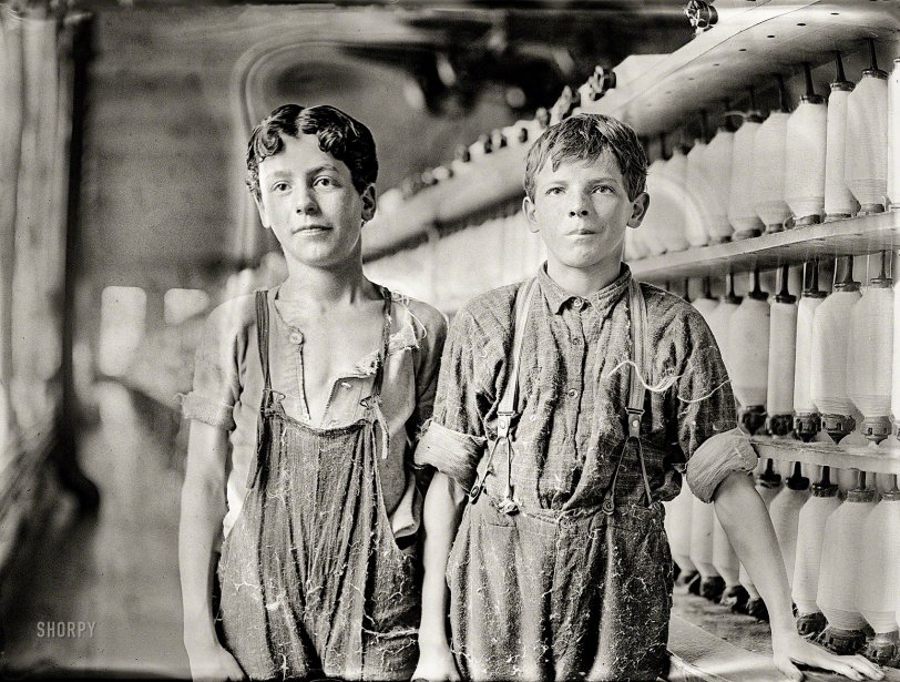 May 1909. "Leopold Daigneau and Arsene Lussier, 'back-roping boys' in mule-spinning room at Chace Cotton Mill, Burlington, Vermont." Glass negative by the child-labor reformer Lewis Wickes Hine. View full size.
