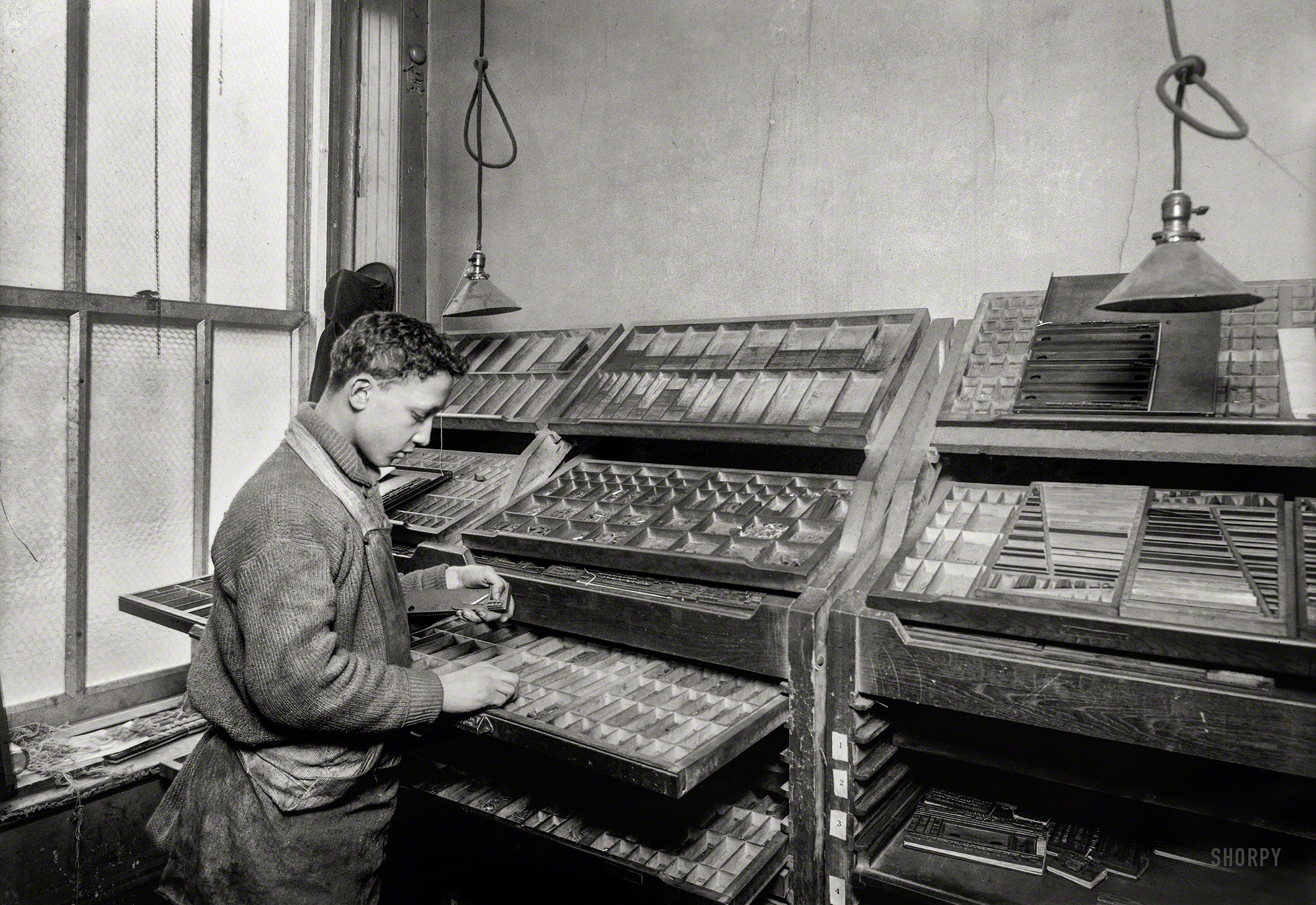 February 1917. New York. "Louis Gitney, a young compositor earning $7 a week in a Sixth Avenue (N.Y.) printing office. He learned the trade at Public School 64." 5x7 inch glass negative by Lewis Wickes Hine. View full size.