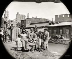 June 9, 1865. "Negro freedmen by canal -- group of Contrabands at Haxall's Mill, Richmond." Wet plate stereograph by Alexander Gardner. View full size.