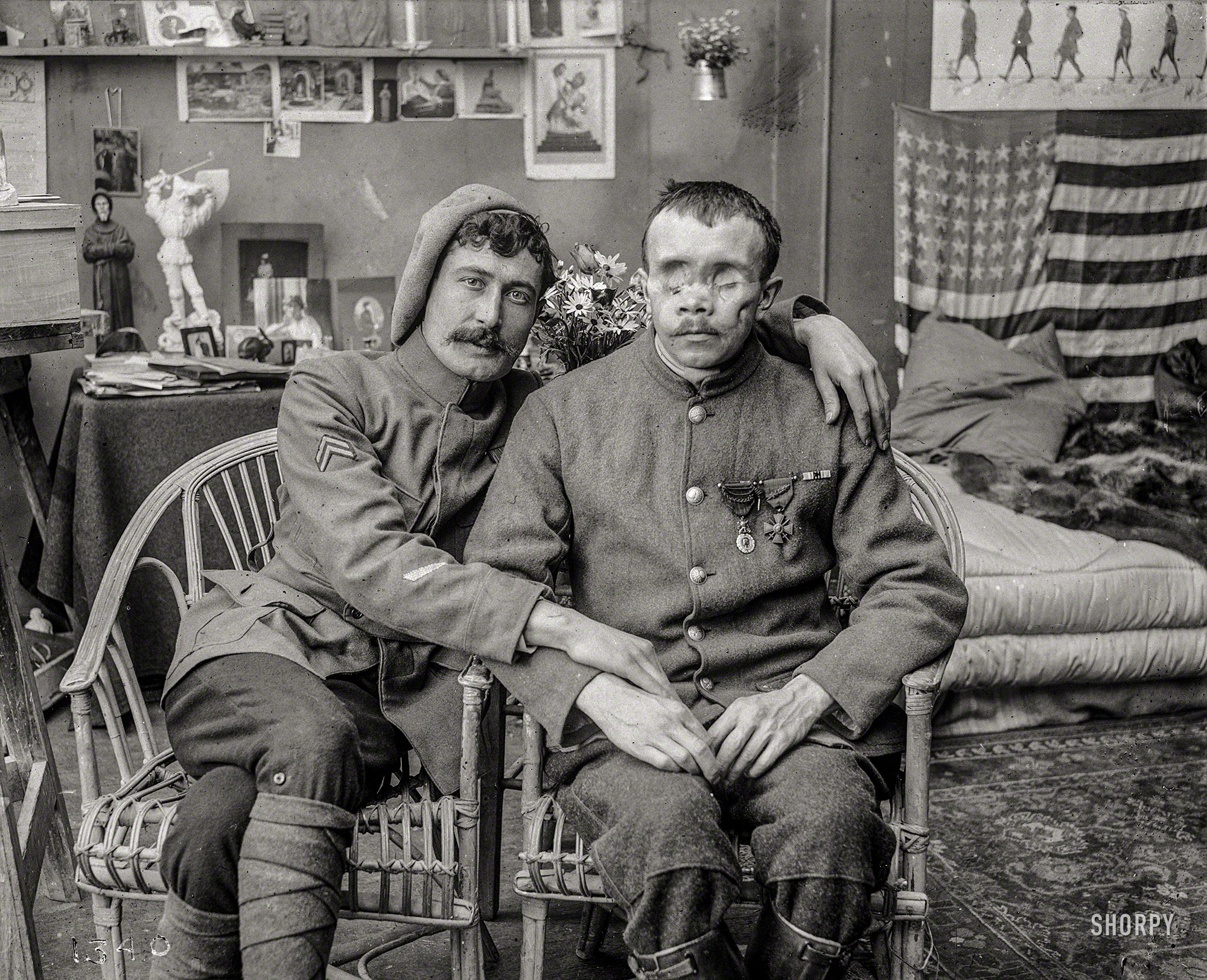 France. April 1918. "The horrible disfigured man of war can not cool the warmth of the friendship of his old comrade for Alexandre the blind mutile, but the Red Cross can not leave him without further aid." 5x7 glass negative from the American National Red Cross Photograph Collection, Library of Congress. View full size.