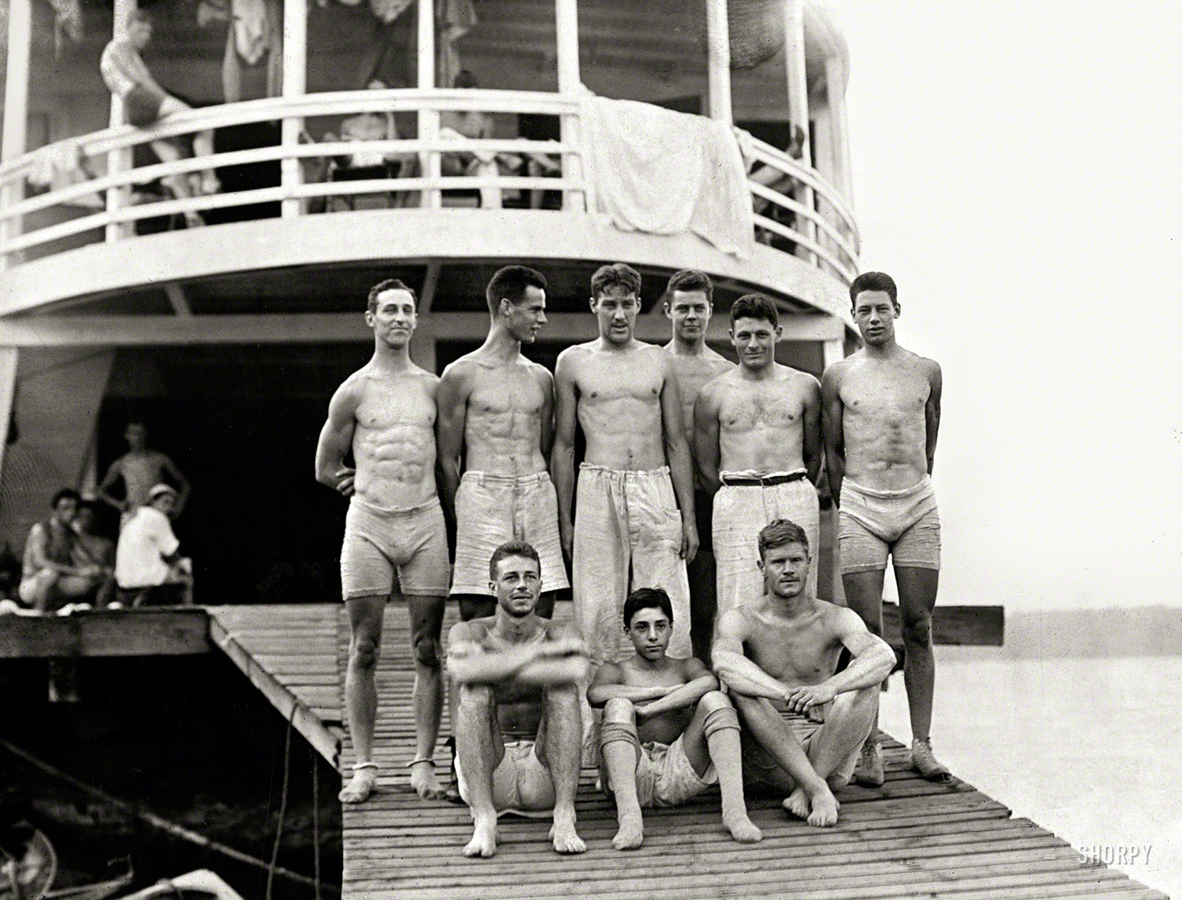1910. "Columbia crew at Poughkeepsie boathouse -- Members of the Columbia University varsity eight-oared crew team. Top row: R.K. Murphy, F. Miller, Paul Renshaw, A.M. Hamman, W. Steinschneider, G. Downing; bottom row: S. Pitt, A. Brock, and F.H. Saunders at Poughkeepsie, New York, for an intercollegiate regatta." Gelatin silver print. Bain News Service. View full size.