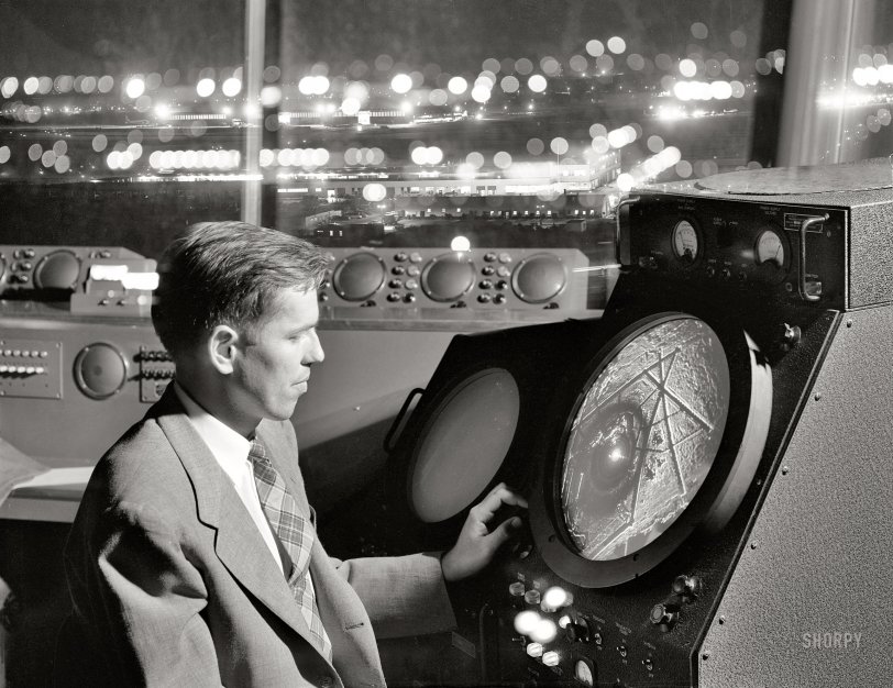 September 1952. "Man in an airport control tower looking at radar screen. Also other equipment used by air traffic controllers." Acetate negative from the Look magazine assignment "International Airport." View full size.
