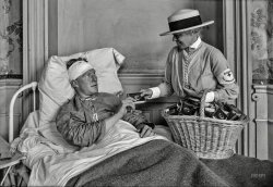 June 24, 1918. "Representative of American Red Cross Home Communication Service distributing cigarettes in hospital at Contrexeville, France." 5x7 glass negative by Lewis Hine for the American National Red Cross. View full size.