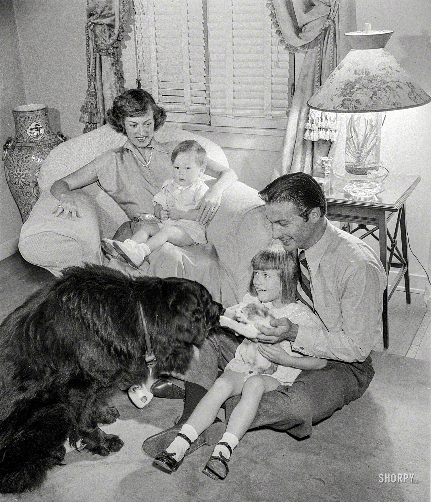 Los Angeles, 1948. "Actor Lex Barker and his family -- wife Constance Rhodes Thurlow, son Alexander Crichlow Barker III, and daughter Lynn Thurlow Barker with their dog and cat." From photos by Maurice Terrell for the Look magazine assignment "Princeton-Bred Tarzan." View full size.