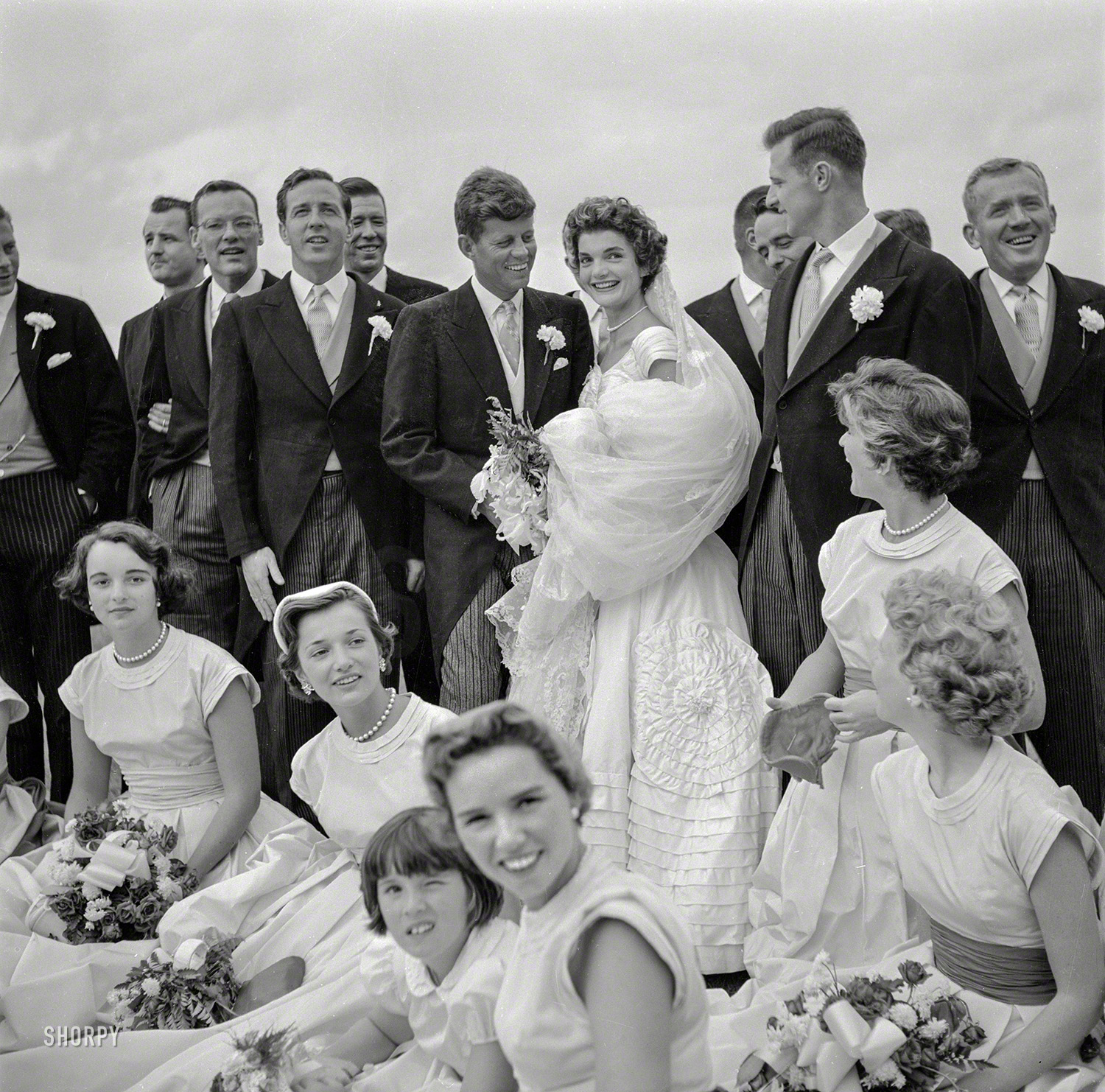 "Jacqueline Bouvier and John F. Kennedy at their wedding, September 12, 1953, Newport, Rhode Island." Acetate negative by Toni Frissell. View full size.