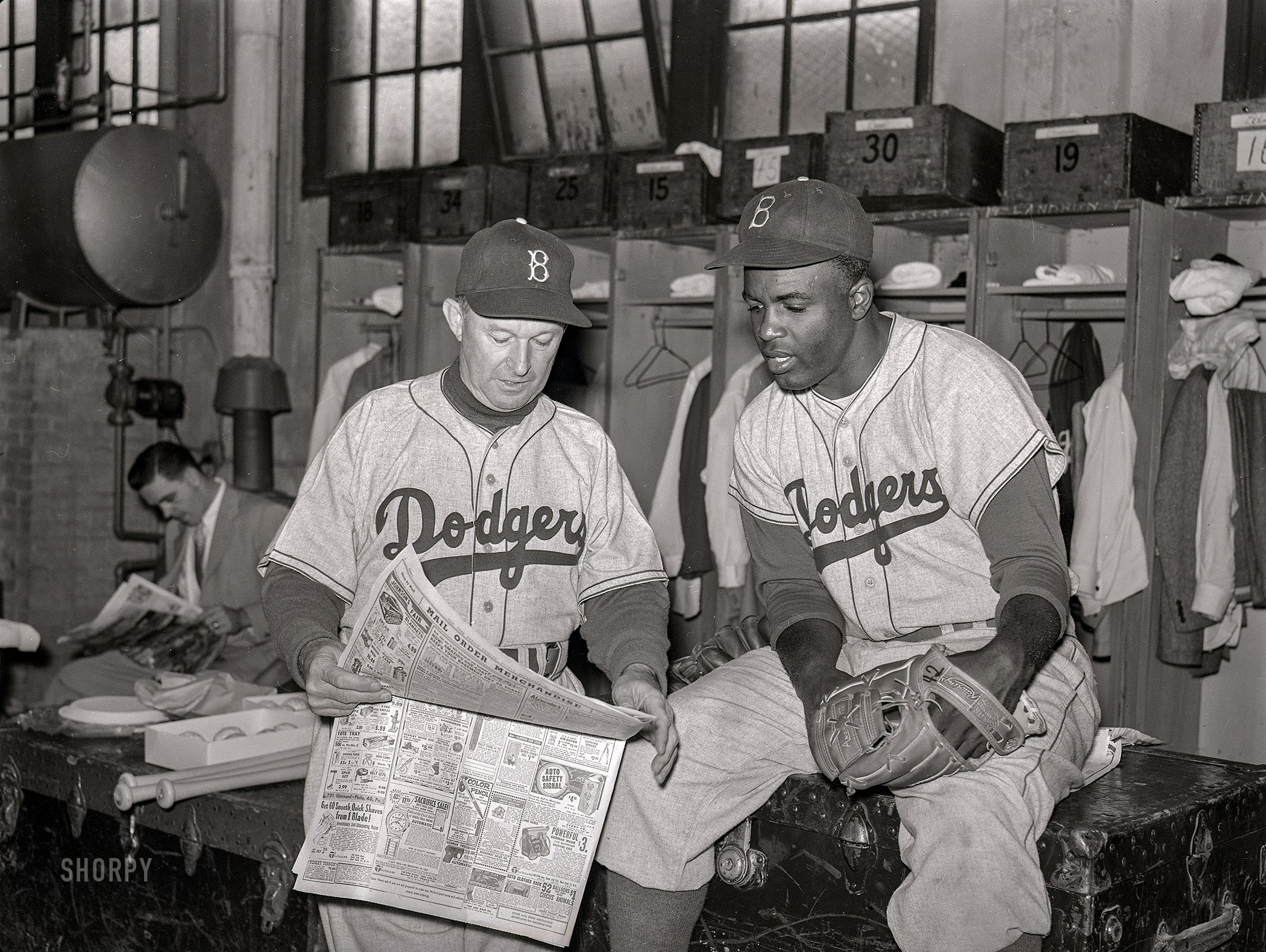 September 1952. "Brooklyn Dodgers manager Charley Dressen the locker room with Jackie Robinson." Acetate negative from photos by Arthur Rothstein for the Look magazine assignment "Charley Dressen -- Genius Along the Gowanus." View full size.