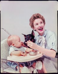 &nbsp; &nbsp; &nbsp; &nbsp; AND THE MYSTERY CELEBRITY IS ... Oscar-winner Cloris Leachman with her son Adam Englund. "April 27, 1954. Actress Cloris Leachman at home with husband and baby. Includes Leachman bathing infant; husband diapering baby; Leachman feeding baby. Also Leachman in park with family dog." From photos by Phillip Harrington for Look magazine. 

Here's a celebrity snapped quite a few years before becoming really well known. Who'll be first to put a name to this now-familiar face? View full size.