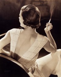 Ca. 1932. "Woman holding a cigarette." Gelatin silver print by Wynn Richards. View full size.