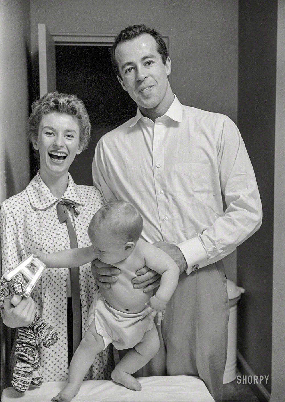 April 1954. New York. "Actress Cloris Leachman at home with husband George Englund and baby Adam." The future Oscar and Emmy winner would be coming soon to the big screen in the 1955 noir classic Kiss Me Deadly. 35mm negative from photos by Phillip Harrington for Look magazine. View full size.