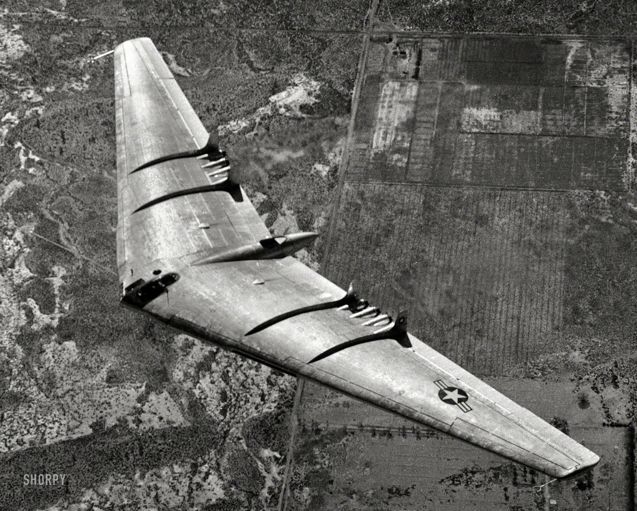 1948. "Aerial view of U.S. Air Force's 100-ton Northrop Flying Wing YB-49 jet bomber in flight. Northrop Aircraft Inc., Hawthorne, California." View full size.