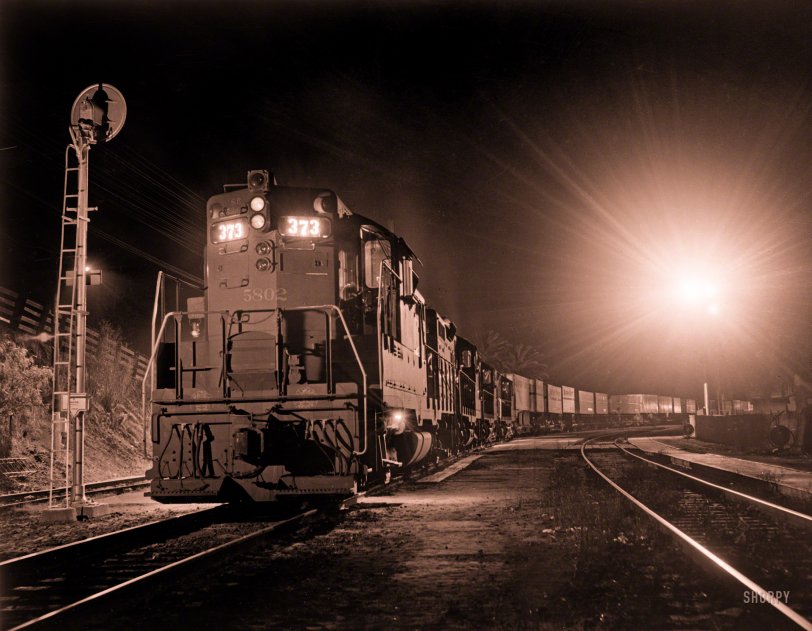 &nbsp; &nbsp; &nbsp; &nbsp; UPDATE: One source attributes this image to Richard Steinheimer, the "Ansel Adams of railroad photography."

"California freight train at night, February 27, 1962." 8x10 inch Ansco safety negative, photographer unknown. View full size.
