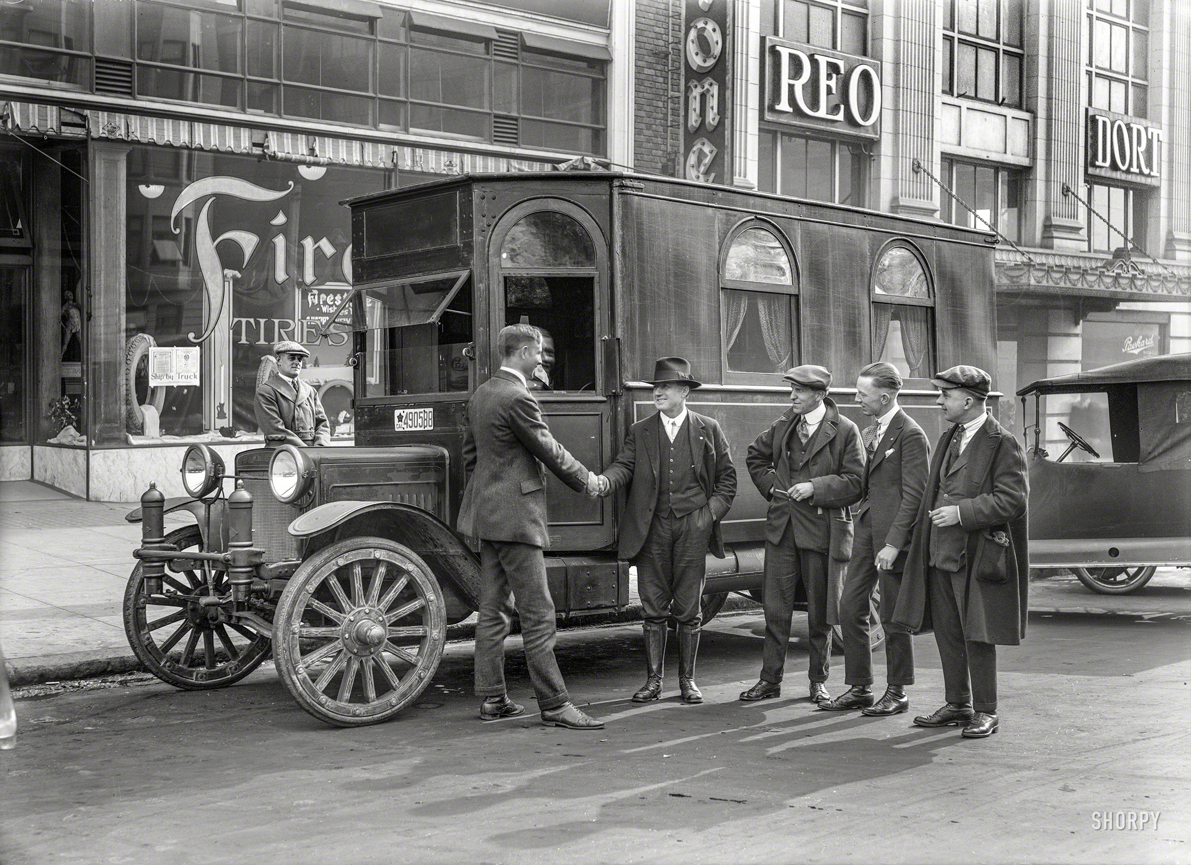 San Francisco circa 1919. "Bus" is all it says on the sleeve of this 5x7 glass negative showing a motor home on an Atterbury truck chassis. In the Firestone display window, it's beginning to look a little like New Year's. View full size.