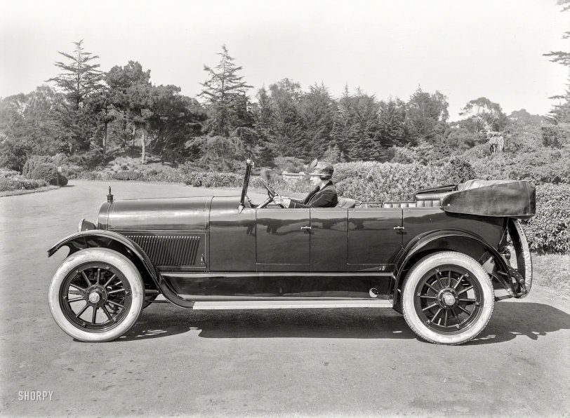 San Francisco circa 1920. "Haynes touring car at de Young Museum, Golden Gate Park." Dapper flapper at the wheel, poised to take flight. Could this be our first photo by Chris Helin to portray someone famous? 5x7 glassneg. View full size.
