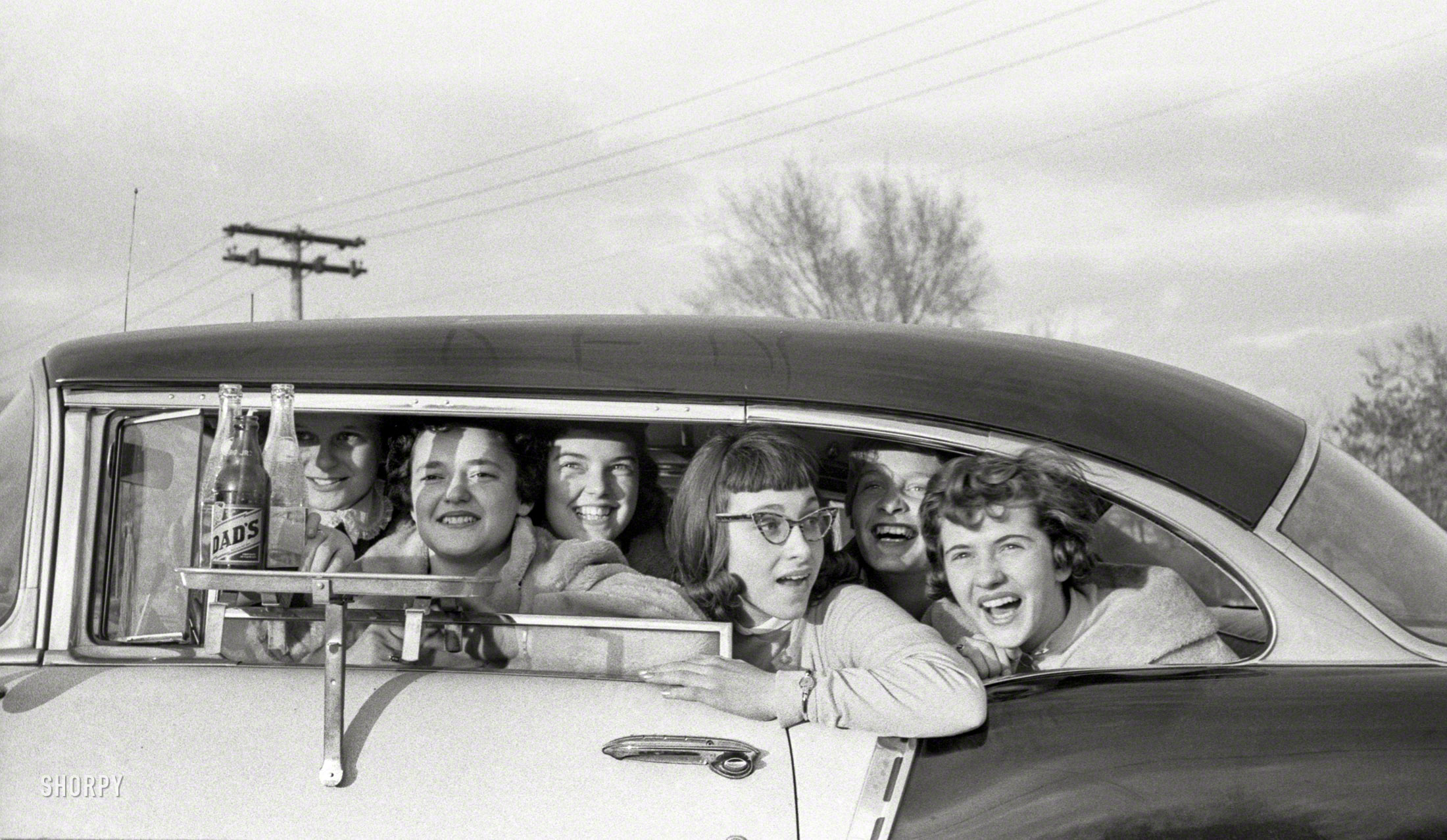 March 1957. Gary, Indiana. "Teenage girls in car at drive-in." From photos for the Look magazine assignment "How American Teenagers Live." View full size.