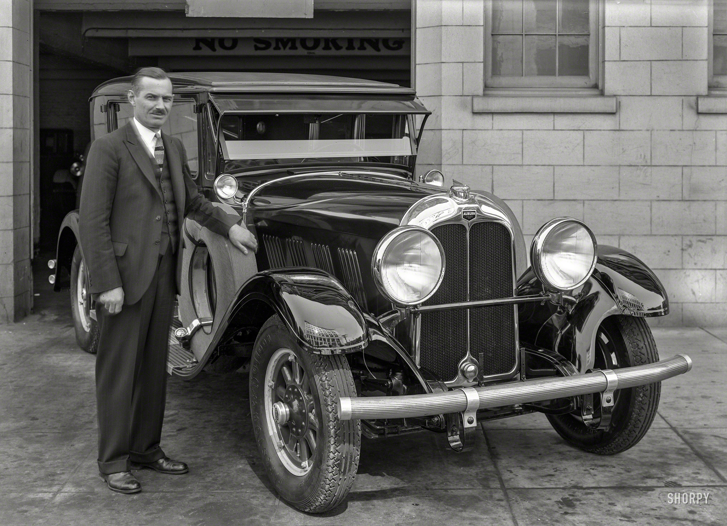 &nbsp; &nbsp; &nbsp; &nbsp; Arthur D'Ettel of the California Automobile Trade Association.
San Francisco, 1928. "Auburn 115 at garage." Right across whatever building that is reflected in the fender. 5x7 glass negative by Christopher Helin. View full size.