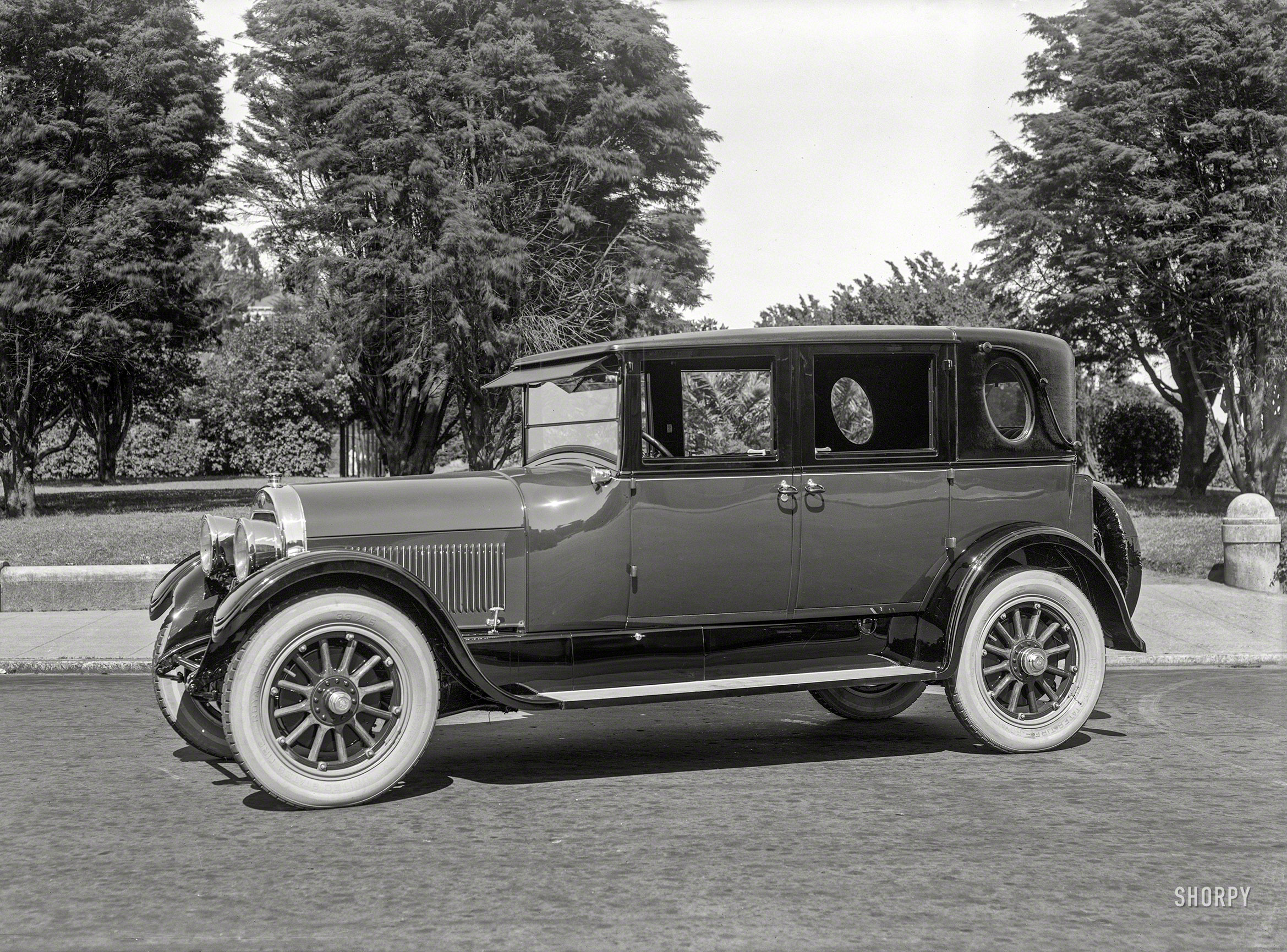 &nbsp; &nbsp; &nbsp; &nbsp; Among the first Cadillacs to have brakes on all four wheels.
San Francisco circa 1925. "Cadillac V63 five-passenger sedan at Lafayette Park." 5x7 inch dry-plate glass negative by Christopher Helin. View full size.