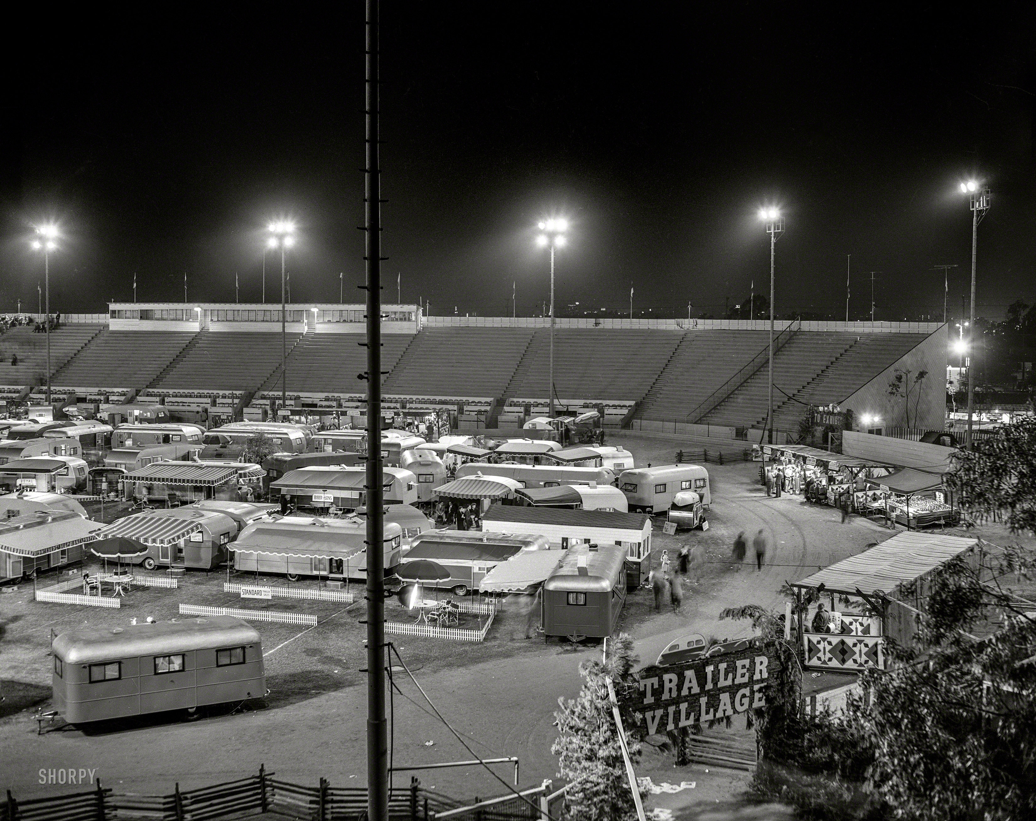 "1947 trailer show at Gilmore Field, Los Angeles." The Gypsy life, mid-century style. 4x5 negative by Watson from the News Photo Archive. View full size.