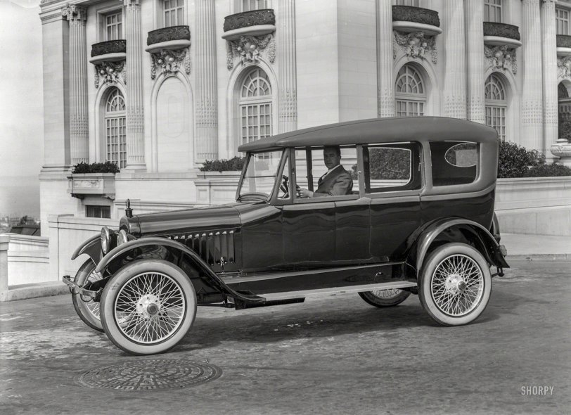 San Francisco circa 1920. "Chalmers touring car at Spreckels Mansion, N.E. corner Octavia &amp; Washington streets." Wearing yet another variation on the "California top," an accessory (this one with sideways-sliding windows) that afforded some of the advantages of the era's heavier, more expensive closed-body models. 5x7 inch glass negative by Christopher Helin. View full size.

