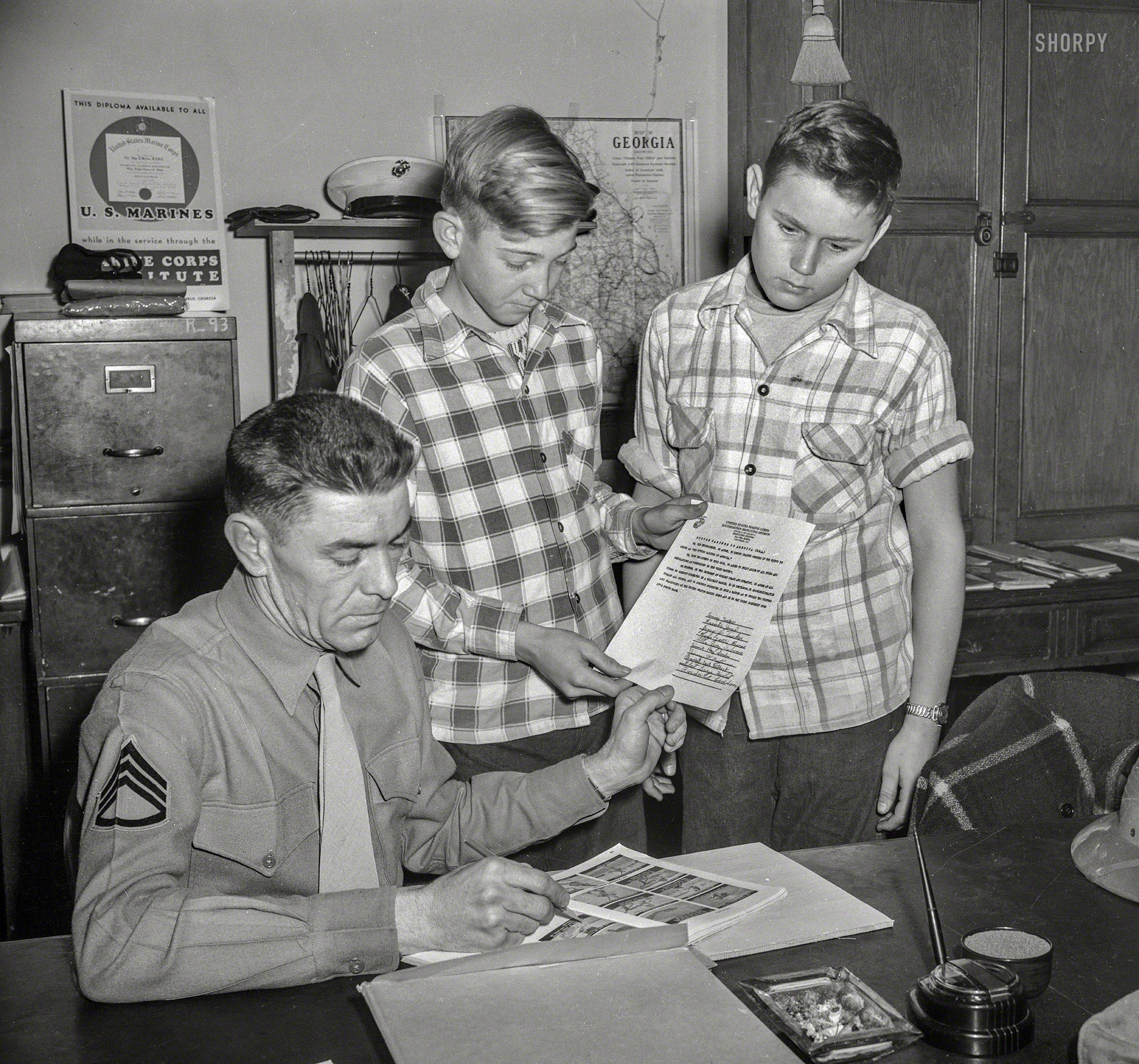 Columbus, Georgia, 1951. "Future Marines of America -- Juniors." Signatories of the FMA pledge ("We further, in the interest of worldly peace and humanity, do agree at all times to conduct ourselves in a military manner") include Tommy Tucker, Jerry Tucker, Lasseter Jones and Allen Leroy Osborne. 4x5 acetate negative from the News Photo Archive. View full size.