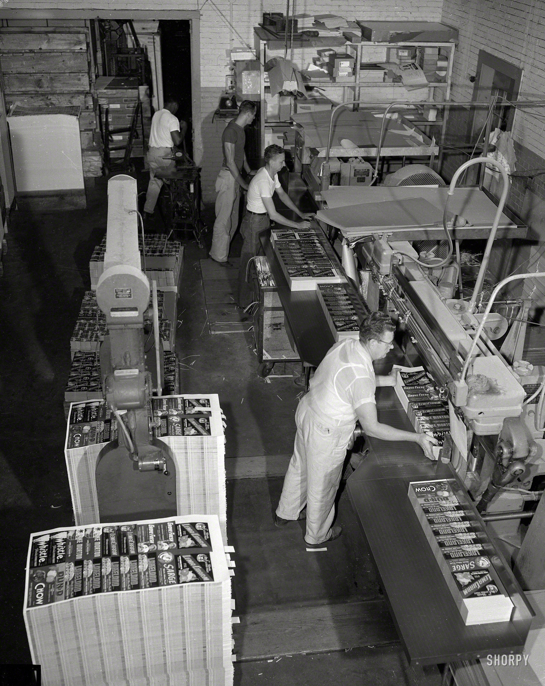Columbus, Georgia, circa 1950, and a print shop making fruit crate labels, back in the days when apples and oranges had something like brand identity. 4x5 inch acetate negative from the Shorpy News Photo Archive. View full size.