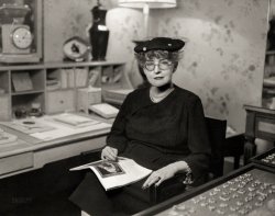 New York circa 1948. "Interior decorator Ruby Ross Wood (1881-1950), three-quarter length portrait, seated, at desk."  Conway Studios photo. View full size.