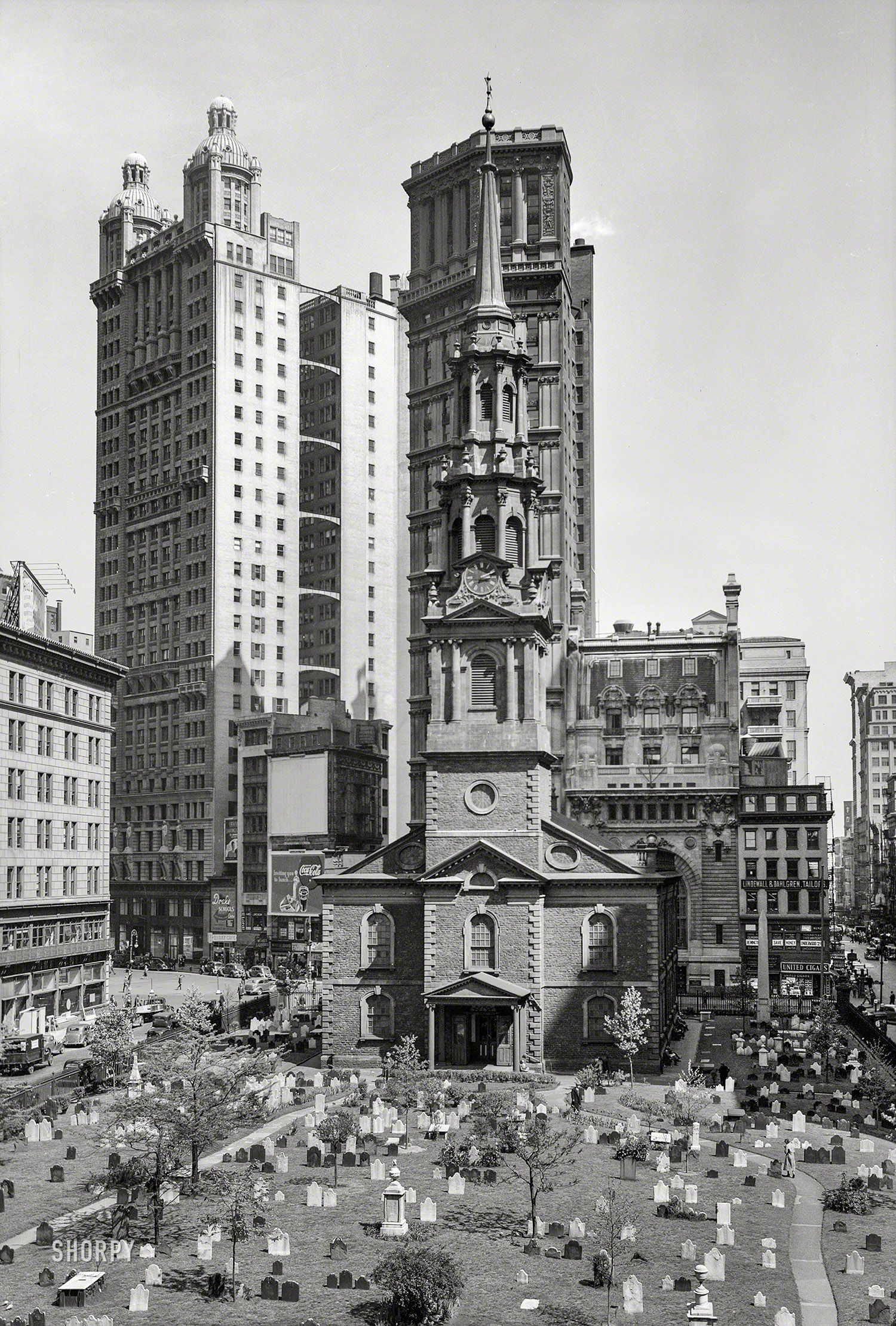 March 2, 1937. New York City. "St. Paul's chapel and churchyard, Broadway and Fulton streets." Overshadowed by two proto-skyscrapers from the 1890s, the Park Row and St. Paul buildings. Photo by Arnold Moses for the Historic American Buildings Survey. View full size.