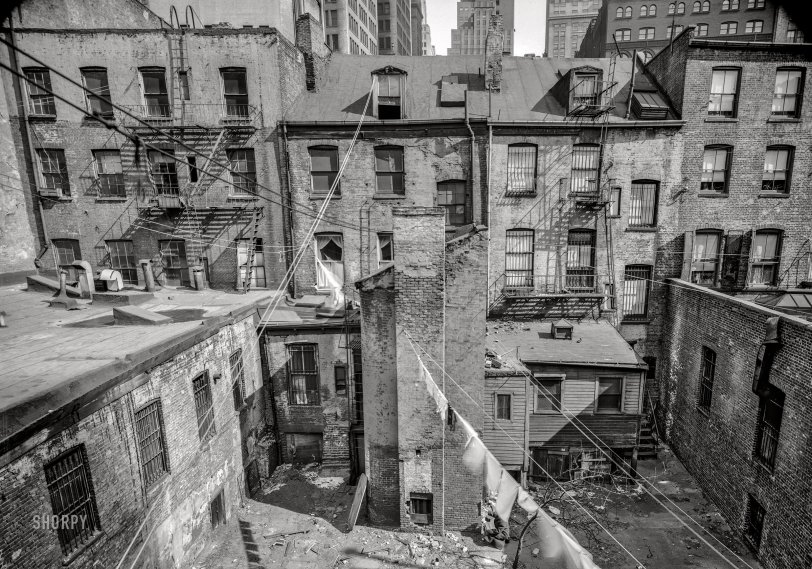 March 22, 1940. New York. "Rear of #68 and #70 Greenwich Street showing dormers and stable ell back of #73 Washington Street at left. Houses built circa 1825." 5x7 inch acetate negative by Stanley P. Mixon for the Historic American Buildings Survey. View full size.