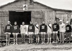 June 17, 1912. "Stanford University varsity crew at Poughkeepsie, N.Y., boat house." Capt. Seward, second from left. 5x7 glass negative. View full size.