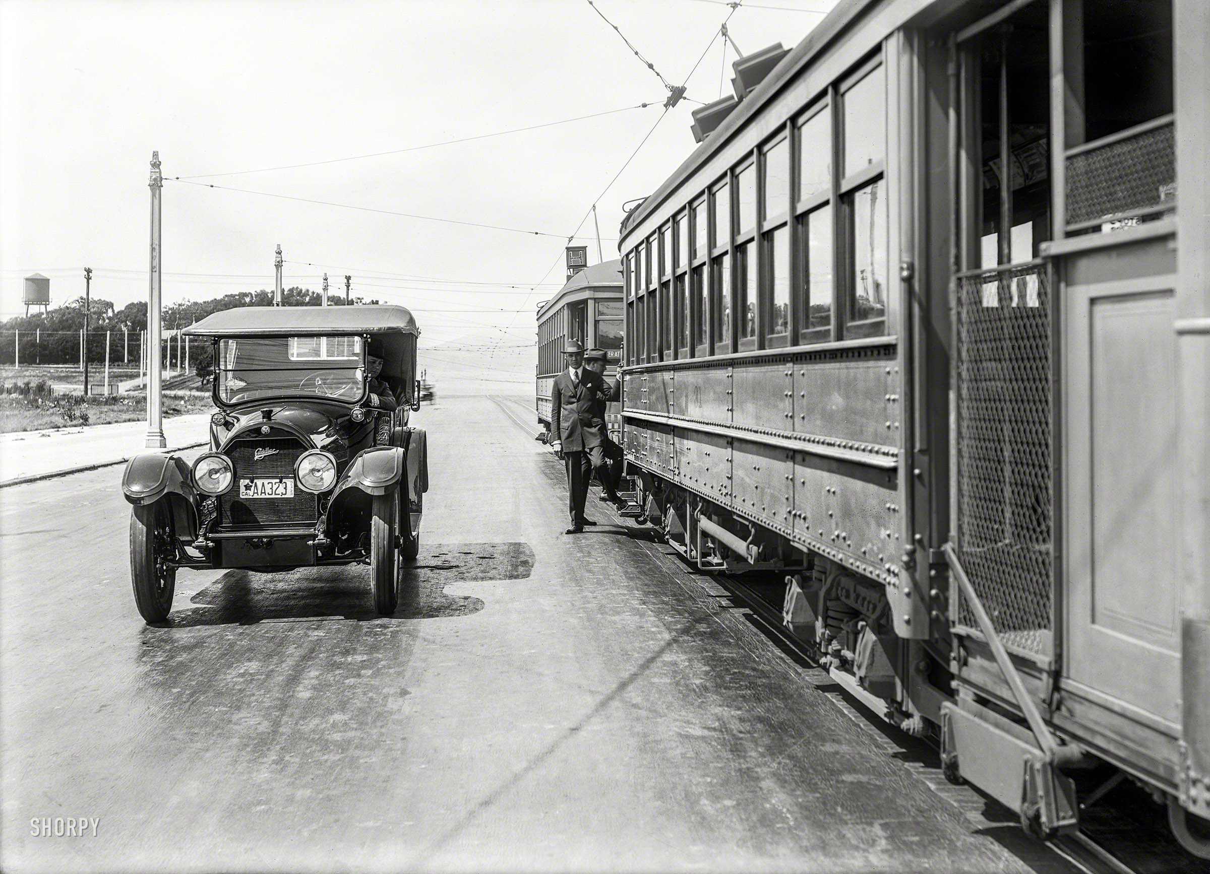 1919. "Cadillac touring car at rail stop." H Line streetcars of the San Francisco Municipal Railway. 5x7 glass negative by Christopher Helin. View full size.