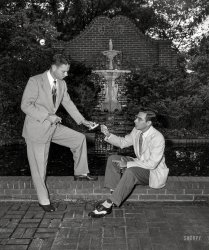 "Shame about Pop falling in the fountain."
"Sad!"
"Lucky?"
"We'll see!"
Columbus, Georgia. "Men's Fashion -- Father's Day 1951." 4x5 inch acetate negative from the Shorpy News Photo Archive. View full size.