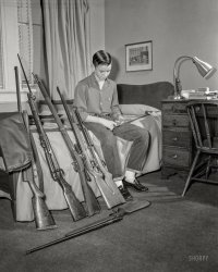 From Columbus, Georgia, or vicinity circa 1959 comes this uncaptioned shot of a guy and his guns, all ready for a well-regulated sleepover. 4x5 inch acetate negative from the Shorpy News Photo Archive. View full size.