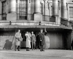 January 24, 1925. "President & Mrs. Coolidge viewing eclipse of sun at White House." National Photo Company Collection glass negative. View full size.