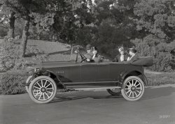 &nbsp; &nbsp; &nbsp; &nbsp; UPDATE: Commenter 426hemi has identified our mystery ride as a 1917 Olympian Motors "Tourist" touring car. The Olympian, made in Pontiac, Mich., lasted from 1917 to 1921; the image above might be, as far as the Internet is concerned, one of the very few (if not only) surviving contemporary photographs of this rare bird.
Circa 1917 San Francisco is the backdrop for this unlabeled shot of four motorists in their anonymous auto, bound for points unknown. With, by the look of things, not a moment to spare! 5x7 glass negative by Christopher Helin. View full size.