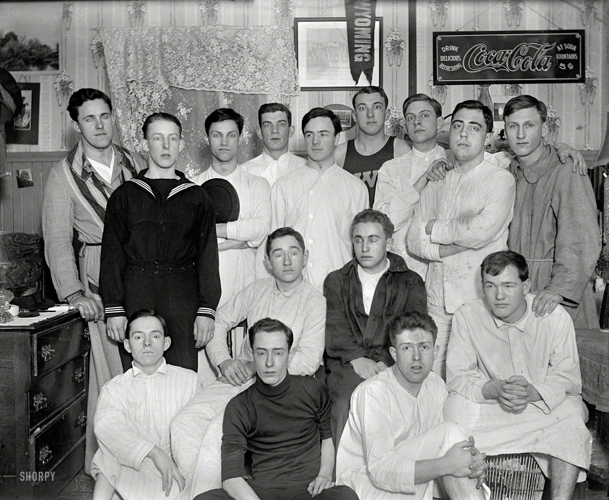 From the early 1900s comes this nightshirted posse of college men, possibly in Wyoming. Three cheers for old Pimento U! 4x5 glass negative. View full size.