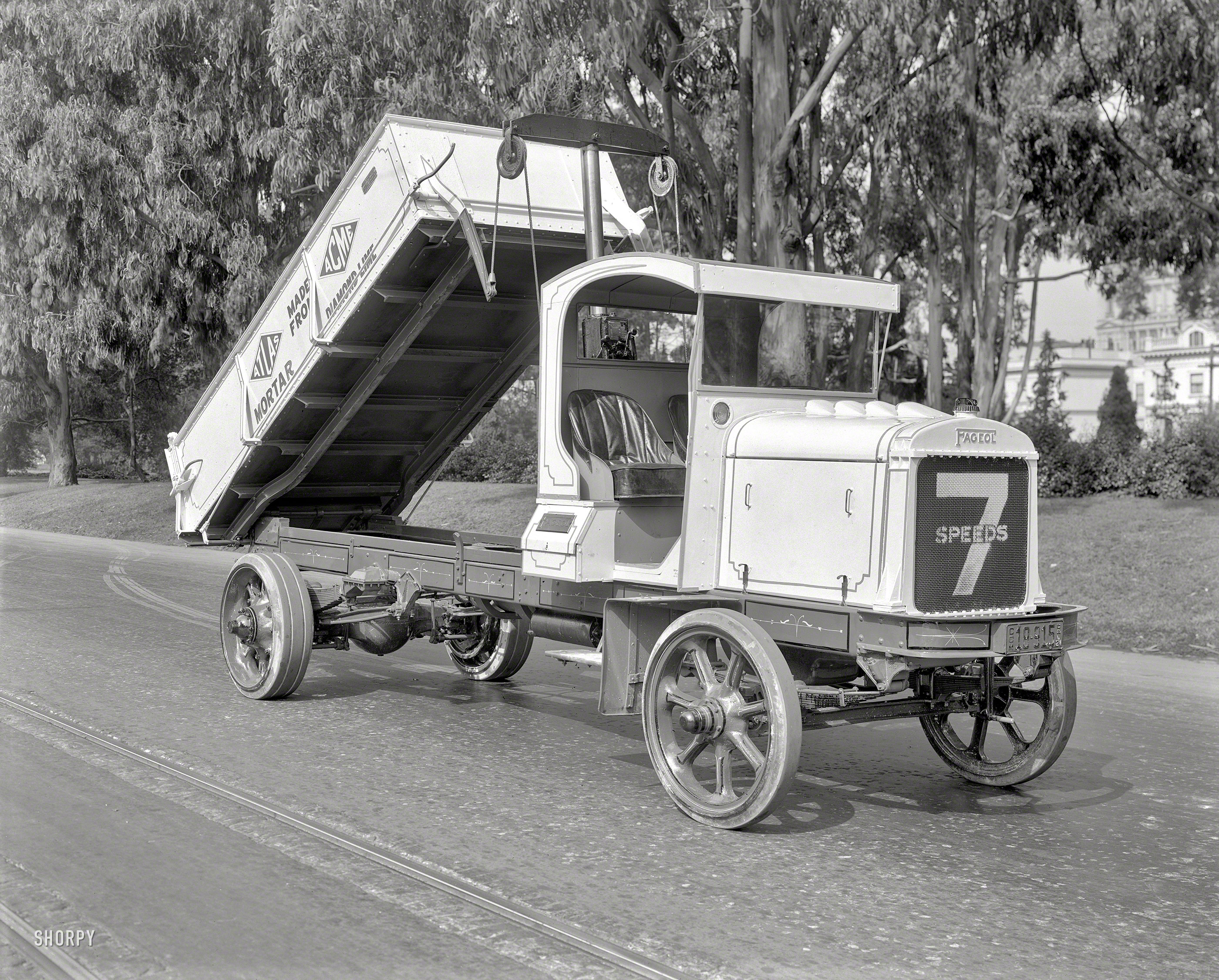 1921. "Fageol dump truck at Golden Gate Park, San Francisco. Atlas Mortar made from Acme Diamond Lime." Nattily pinstriped! 8x10 glass negative acquired from the Wyland Stanley Collection and scanned by Shorpy. View full size.