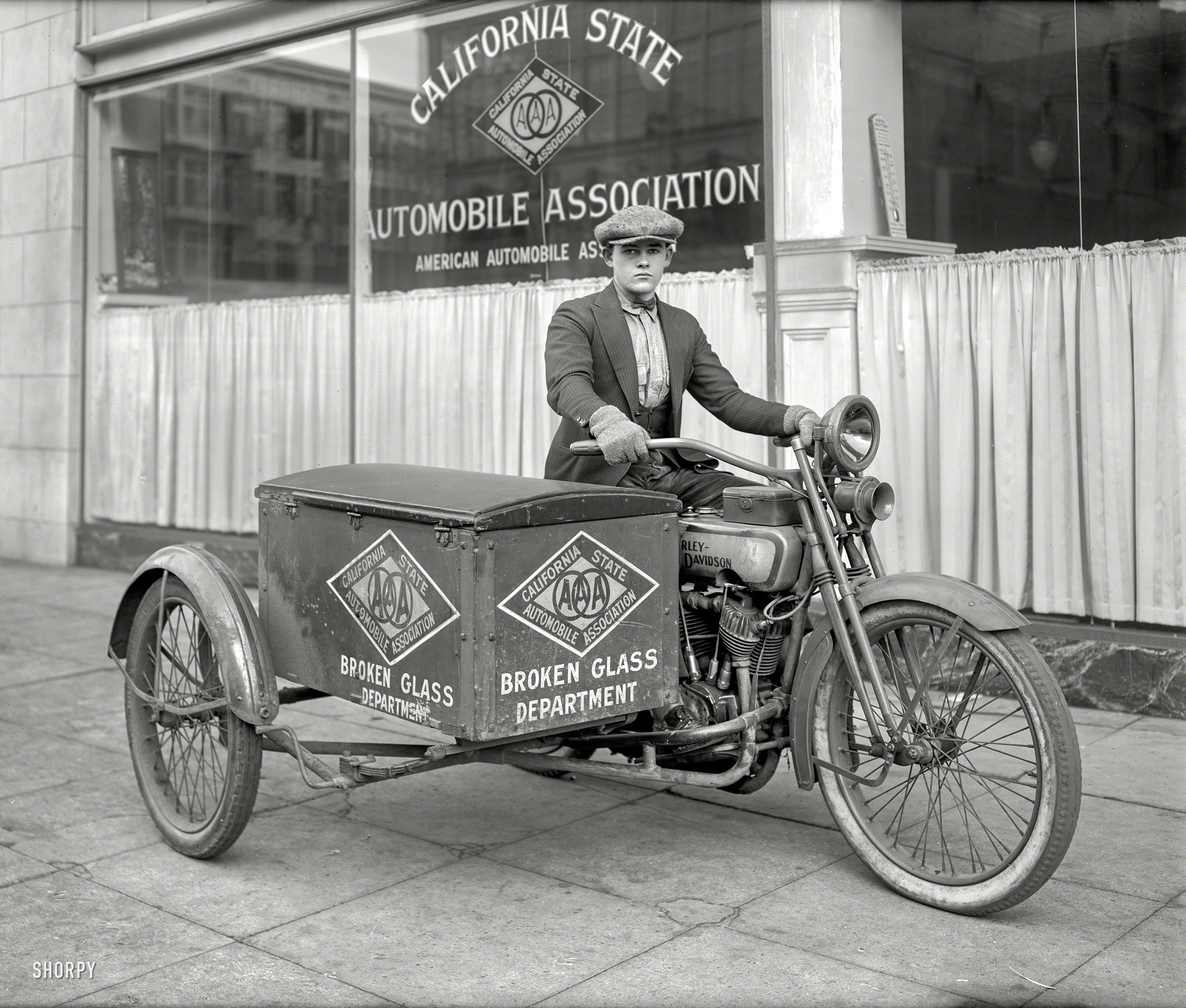 &nbsp; &nbsp; Young Tom started out in Nails & Tacks and worked his way up.
San Francisco ca. 1920s. "Young man on Harley-Davidson motorcycle -- California State Automobile Association 'Broken Glass Department' patrol." 6.5x8.5 glass negative originally from the Wyland Stanley collection. View full size.