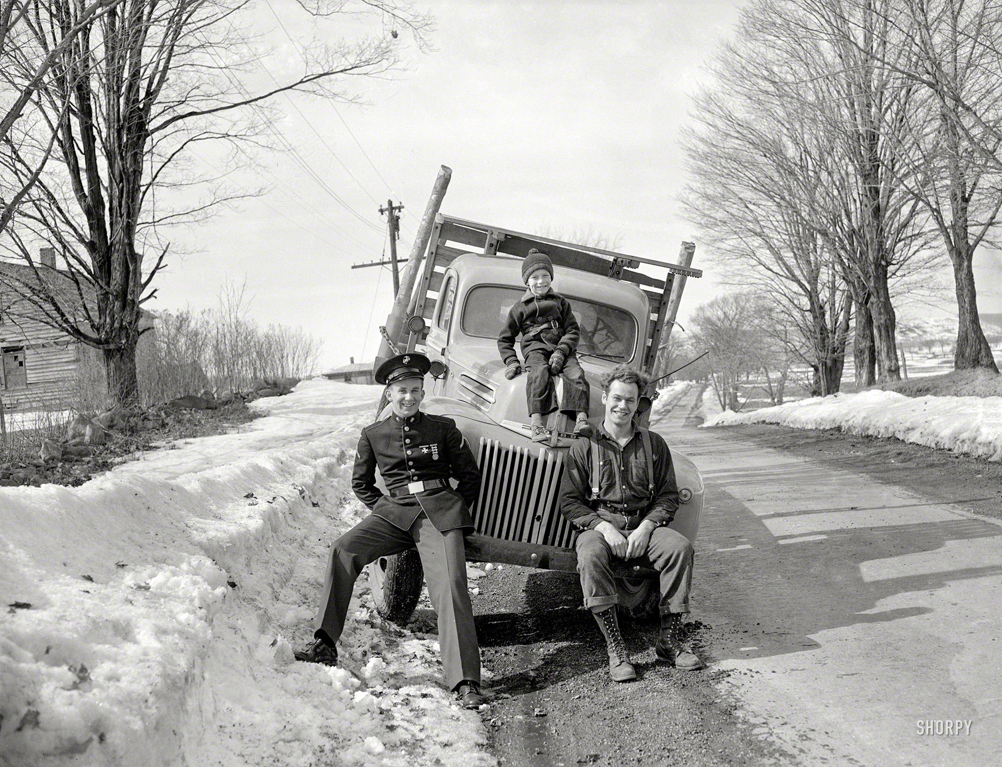 &nbsp; &nbsp; &nbsp; &nbsp; UPDATE: The photographer is Tony Linck, whose work appeared in Life magazine. The location is probably around Utica, New York.
From somewhere in New England in the 1940s comes this uncaptioned 4x5 Agfa negative of three happy guys and their Ford truck. View full size.