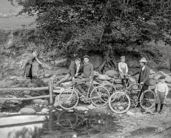 From the early 20th century, somewhere in the Northeast, comes this 4x5 inch glass negative with the caption "L.K. -- bicycles at spring." View full size.