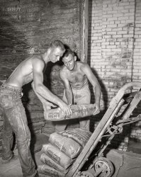 Meanwhile, back in the cement-sack warehouse, these guys are still piling it on. Columbus, Georgia, circa 1955. 4x5 inch acetate negative from the News Photo Archive. View full size.