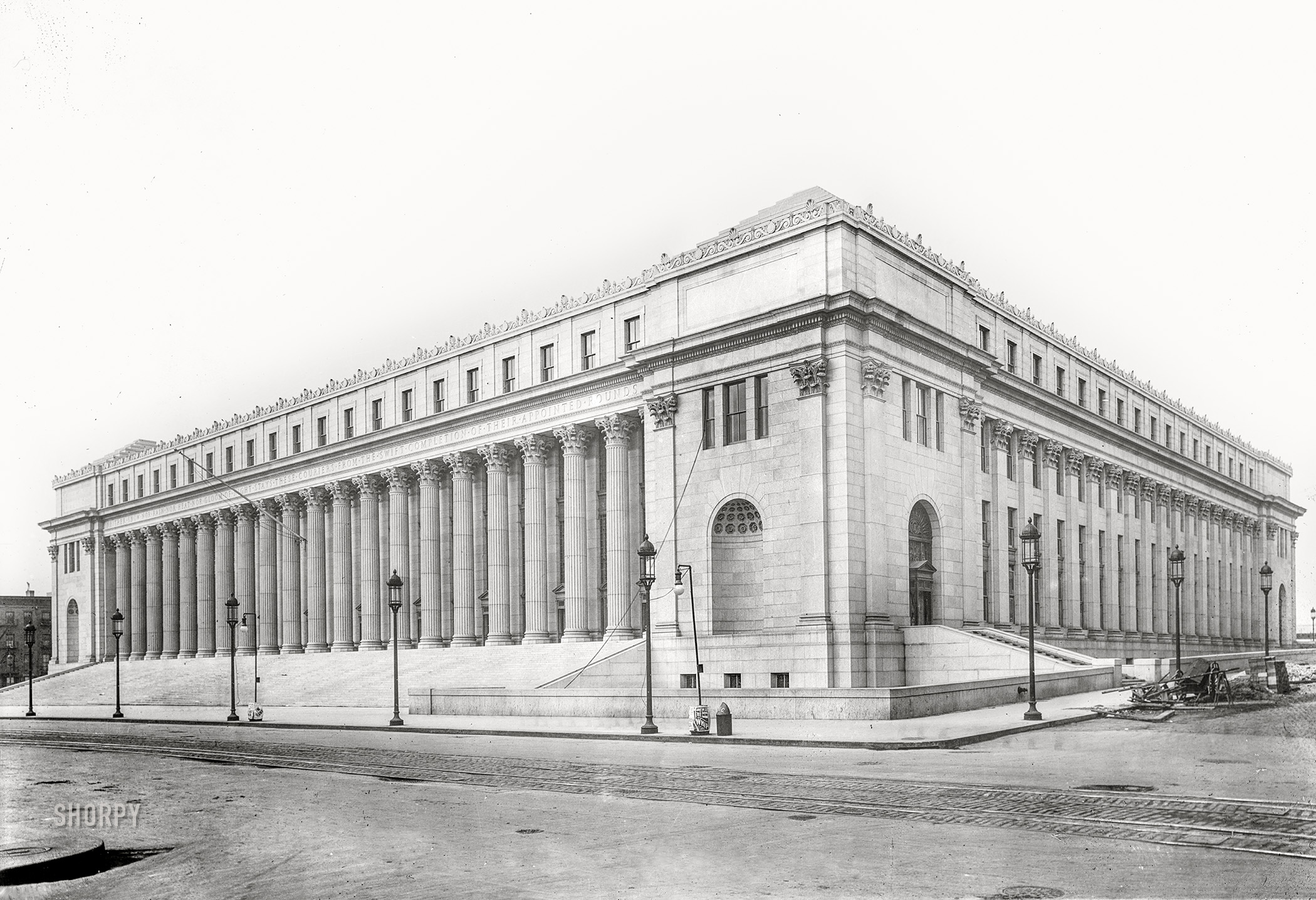 New York's new post office on Eighth Avenue circa 1912. Enlarged in 1934, it's now called the James Farley Building. View full size. In this seemingly deserted time exposure we can see the ghostly images of three different sets of legs.