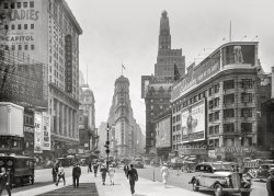 New York, 1935. "Times Square -- The Rialto, Seventh Avenue, Broadway south from W. 46th Street, N.Y. Times building, Paramount Theatre." Gelatin silver print. View full size.