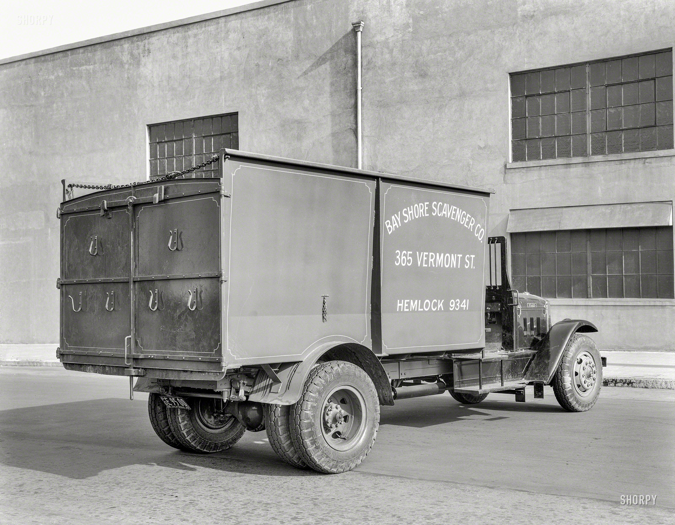 October 1933. "Kleiber motor truck -- Bay Shore Scavenger Co." An ominous-looking conveyance made all the more foreboding by that toxic telephone exchange. 8x10 acetate negative by Christopher Helin. View full size.
