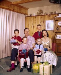 "Merry Christmas from the family." Actor Chuck Connors, his wife Betty and their sons Jeffrey, Steven, Michael and Kevin circa 1960 at their home in Los Angeles. 4x5 inch Ektachrome transparency. View full size.