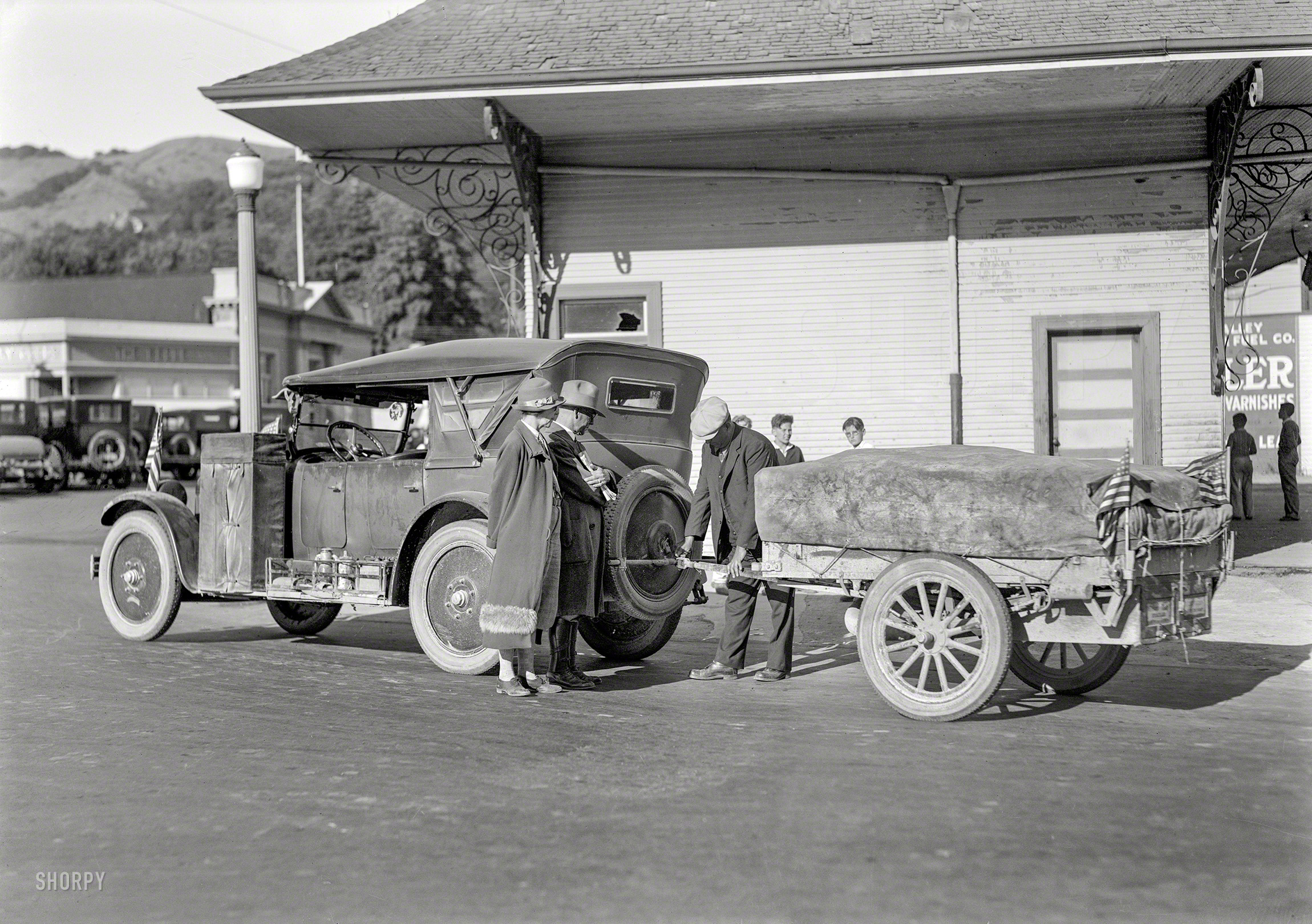 Mill Valley, Calif., circa 1925. "Nash touring car with trailer." Outfitted with a patriotic profusion of flags. 5x7 glassneg by Christopher Helin. View full size.